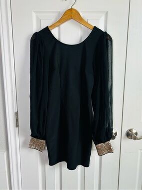 black mini dress sheet long sleeves w/ gold sequin cuffs, open back
